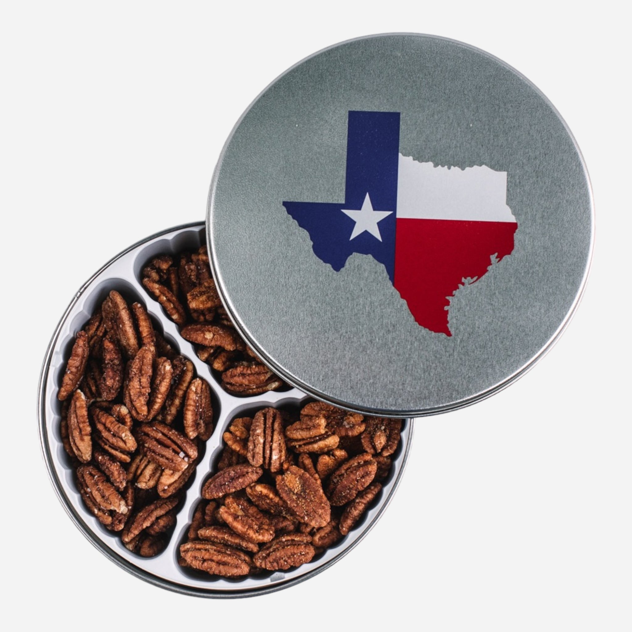 Metal tin of pecans with red, white and blue picture of Texas on the lid