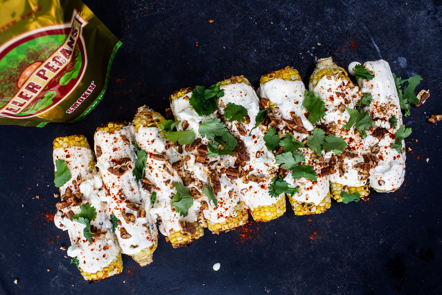 elote corn with smokin' pecans and cilantro. Mexican street corn.