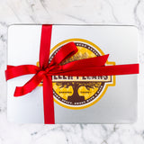 Cinnamon Pecans 24 oz Rectangle Tin tied with Ribbon