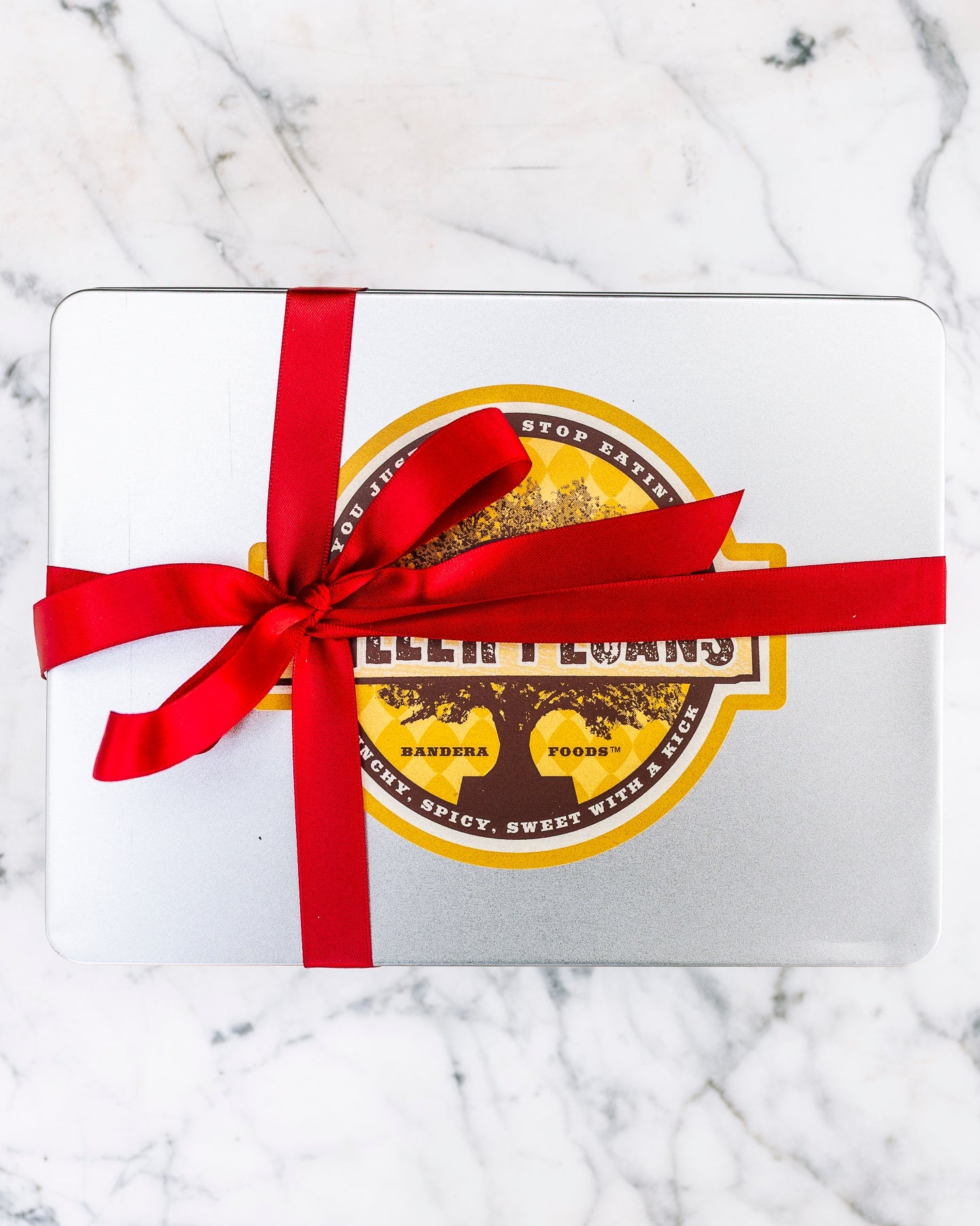 Cinnamon Pecans 24 oz Rectangle Tin tied with Ribbon - Killer Pecans